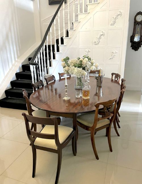 fig 3. A large Georgian mahogany wake table shown with drop leaves folded down, featuring straight square legs and a polished polished timber top.