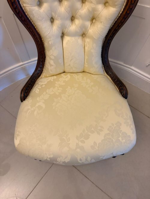 fig 2. A Victorian carved walnut slipper chair featuring a button-tufted cream damask spoon-shaped backrest and cabriole front legs.