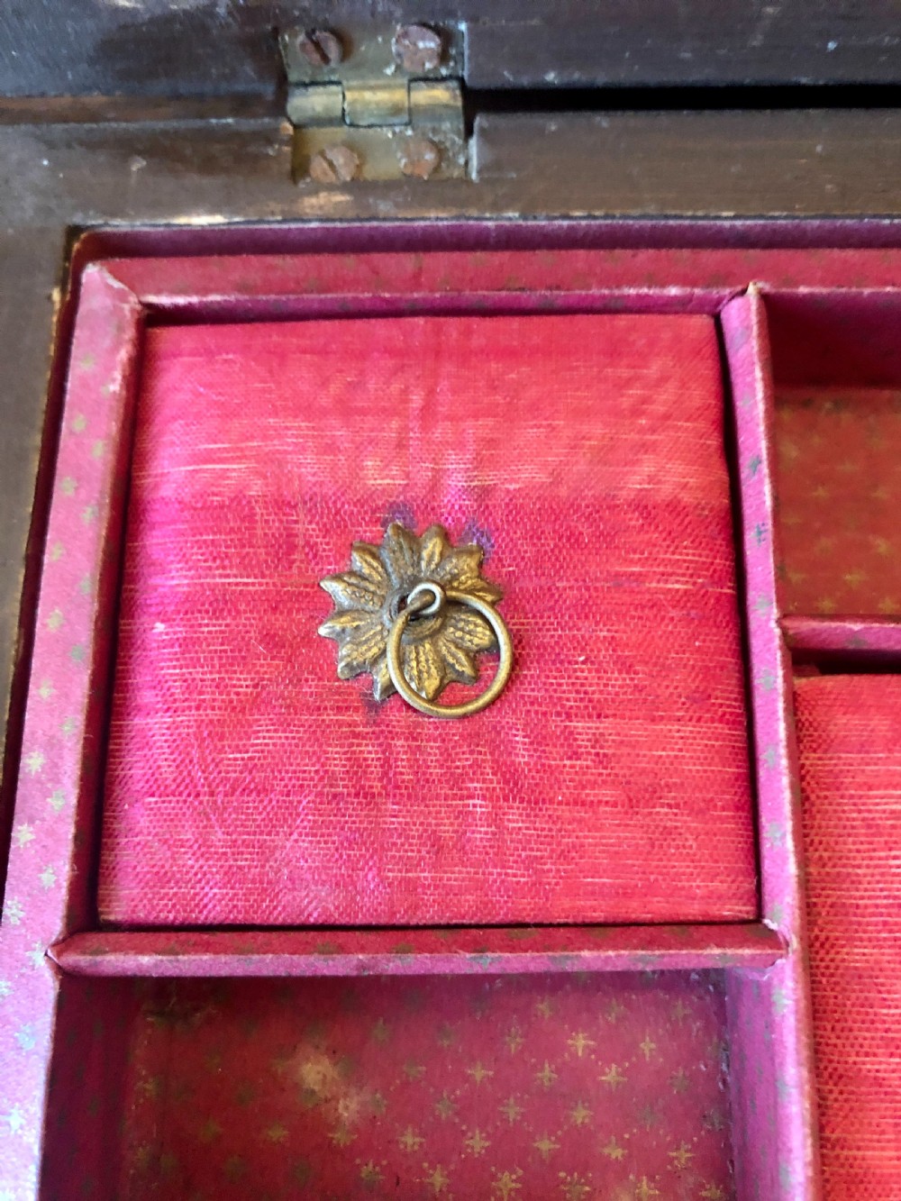A rectangular dark rosewood box featuring mother-of-pearl roundels, inlaid stringing borders, and a mother-of-pearl keyhole escutcheon. View X