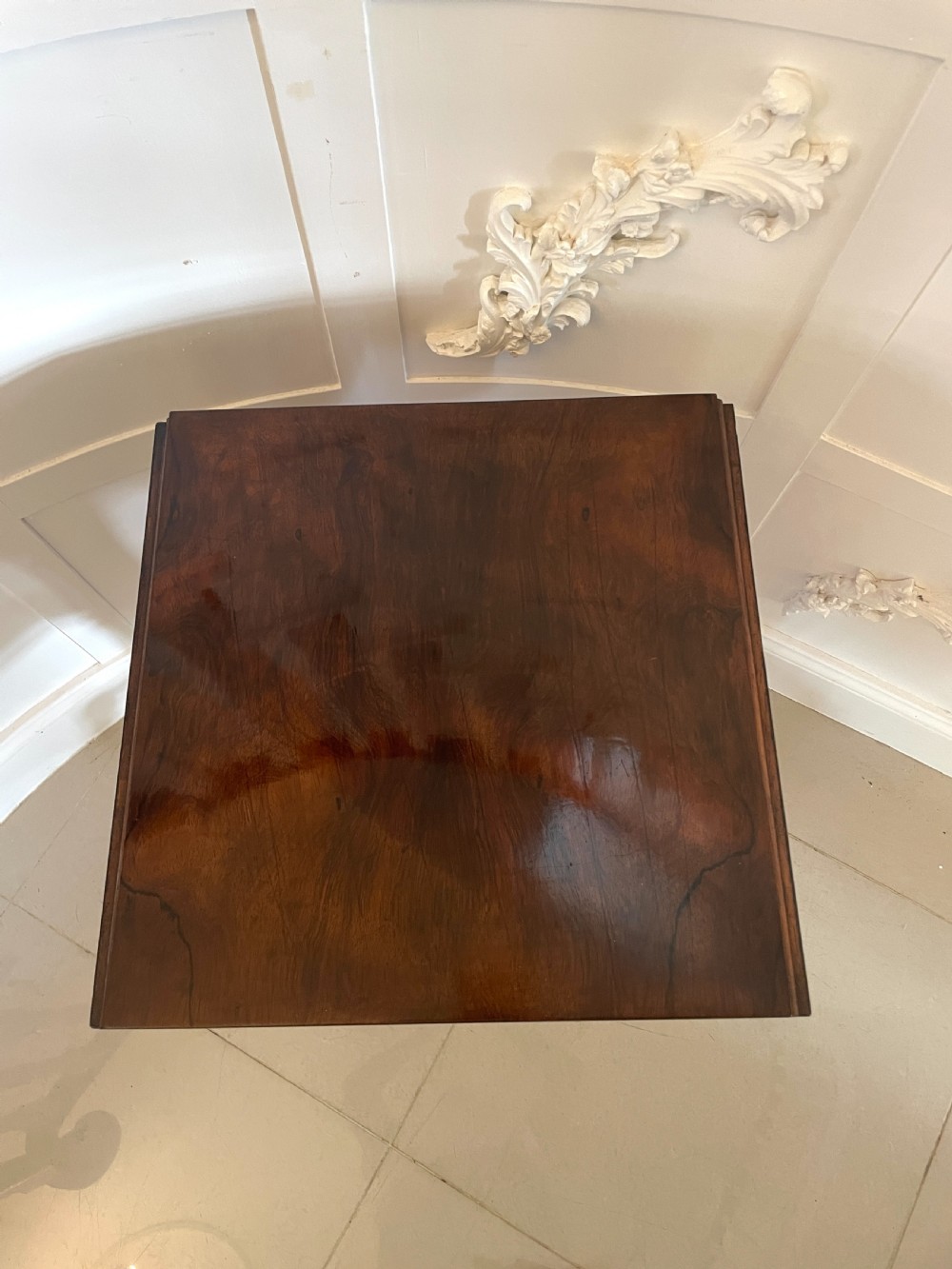 An antique Regency rosewood sewing table featuring small drop leaves, drawers with brass handles, a terracotta fabric work basket below, and a pedestal base with four splayed legs on castors. View XVII