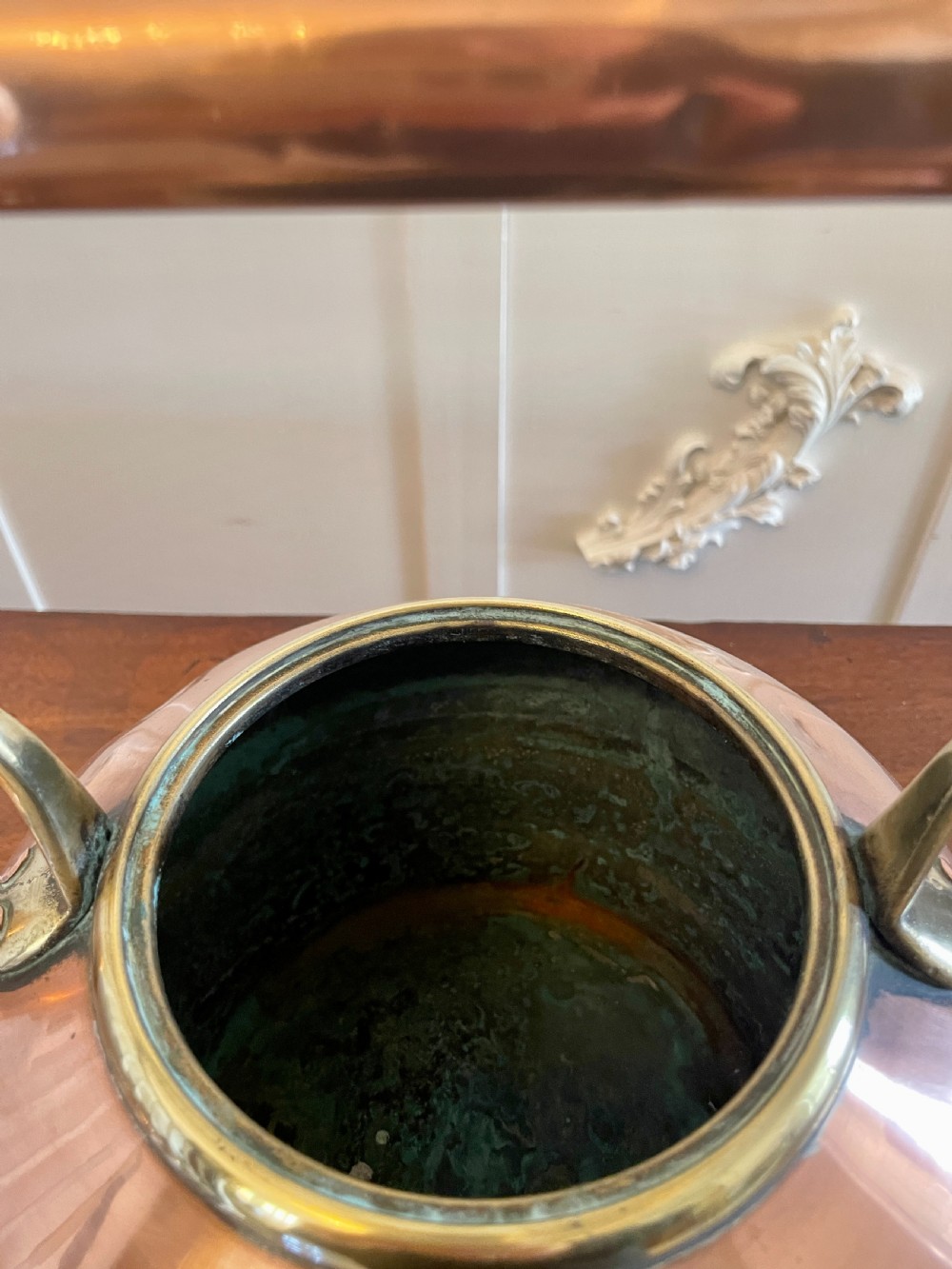 A George III copper tea kettle featuring a brass-accented overhead handle, a gooseneck spout, and a stepped lid with a brass finial. View VI