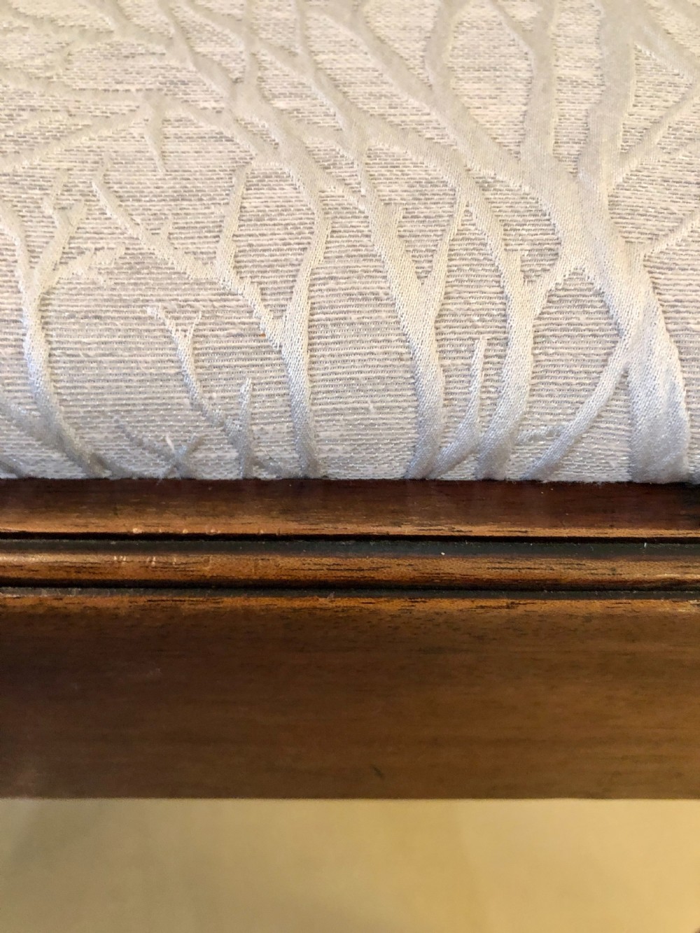 A carved mahogany Chippendale style desk armchair featuring a pierced back splat, scrolled armrests, light upholstered seat, and cabriole legs ending in ball and claw feet. View VIII