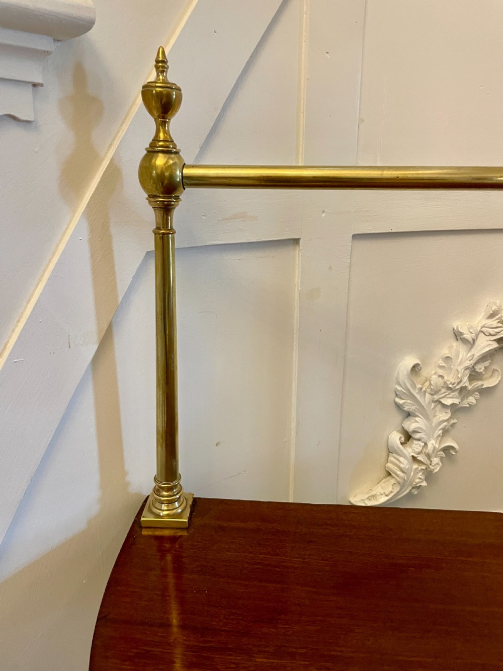A pair of antique George III mahogany demi-lune console tables featuring raised brass gallery rails and square tapered legs. View VII