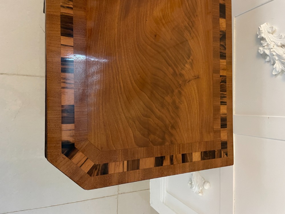 A Regency mahogany fold-over card table featuring crossbanded inlay, a central pedestal base, and four splayed legs with brass paw castors. View XIII
