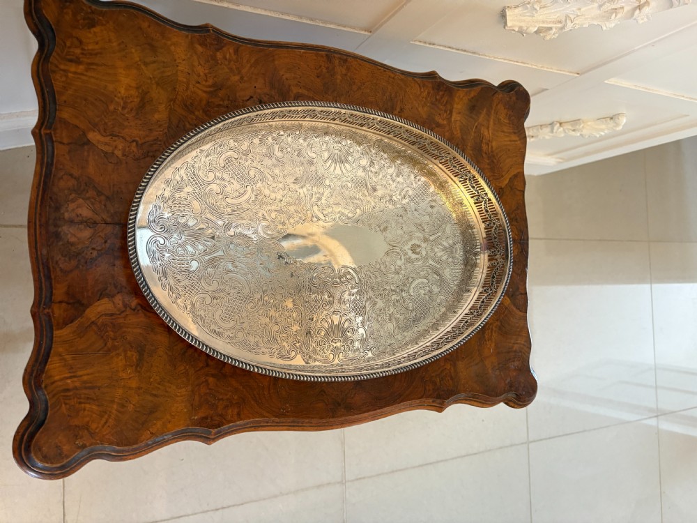 An oval antique Edwardian silver-plated gallery tray featuring intricate floral surface chasing and a raised pierced rim. View III