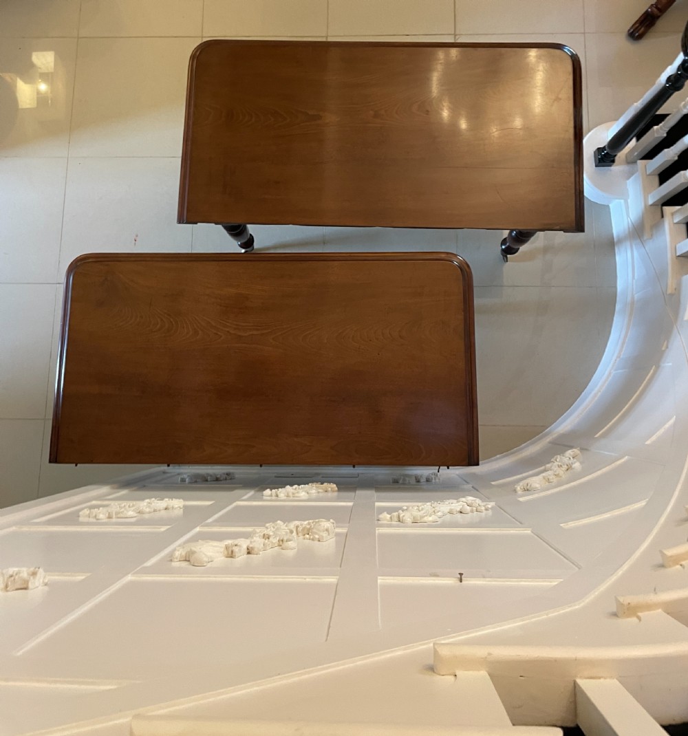 A large Victorian extending mahogany dining table featuring turned legs fitted with brass castors and a polished top with rounded corners. View II