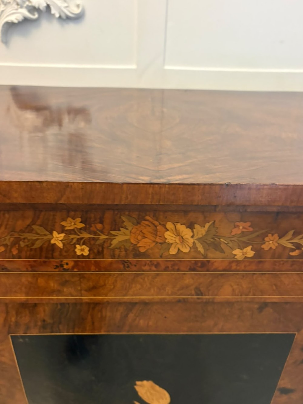 A nineteenth-century Victorian burr walnut credenza featuring curved side doors, intricate floral marquetry inlays, and gilt bronze mounts. View III
