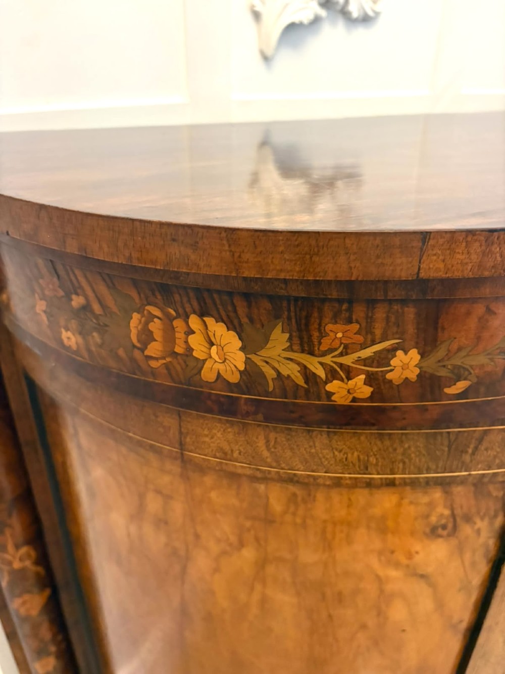 A nineteenth-century Victorian burr walnut credenza featuring curved side doors, intricate floral marquetry inlays, and gilt bronze mounts. View IV