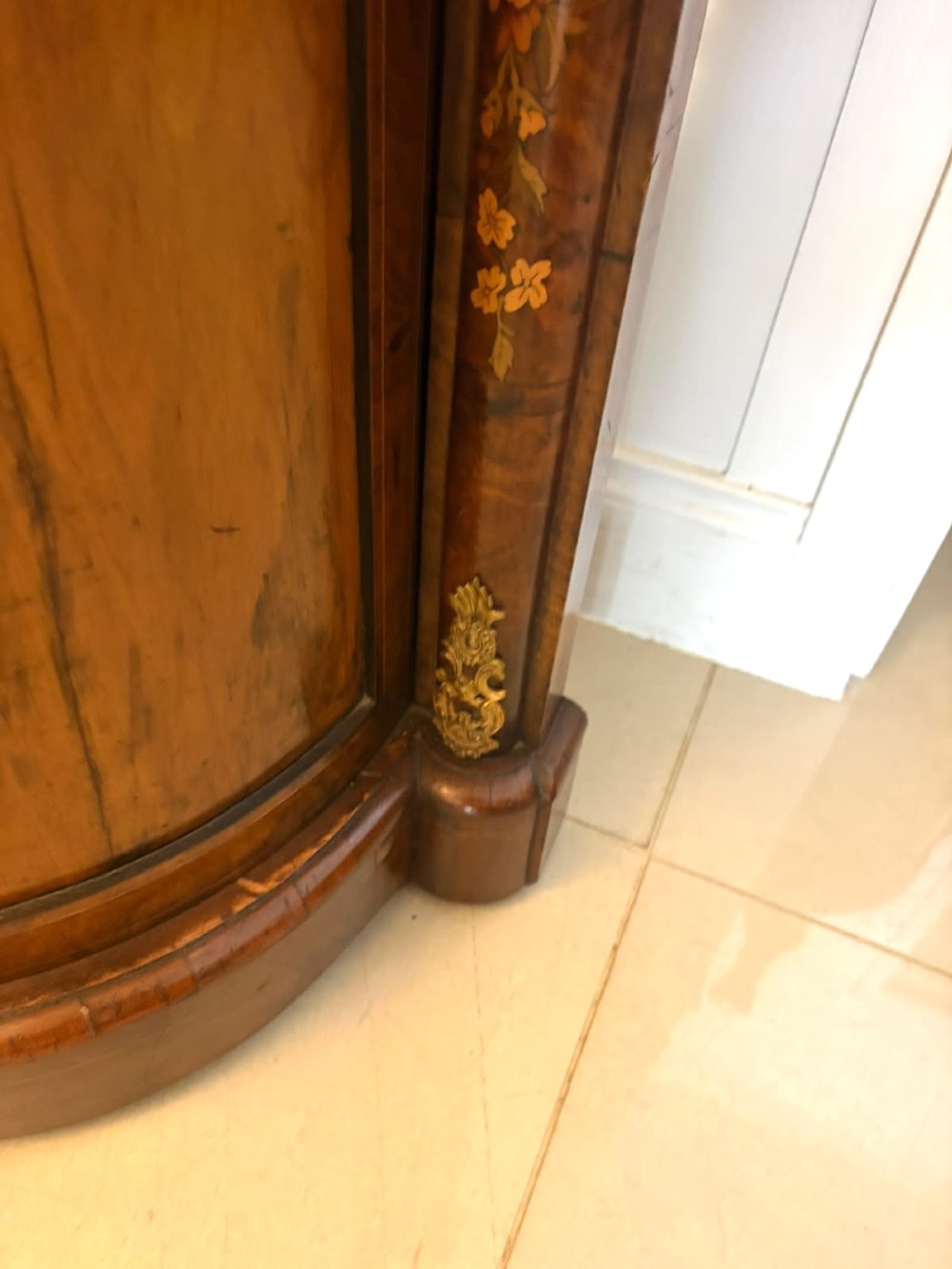 A nineteenth-century Victorian burr walnut credenza featuring curved side doors, intricate floral marquetry inlays, and gilt bronze mounts. View VII