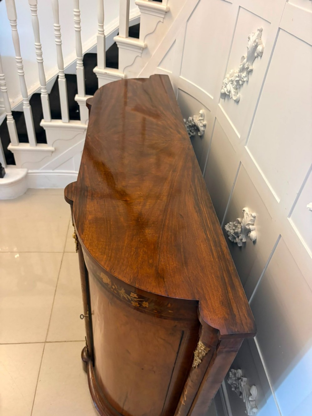 A nineteenth-century Victorian burr walnut credenza featuring curved side doors, intricate floral marquetry inlays, and gilt bronze mounts. View XI