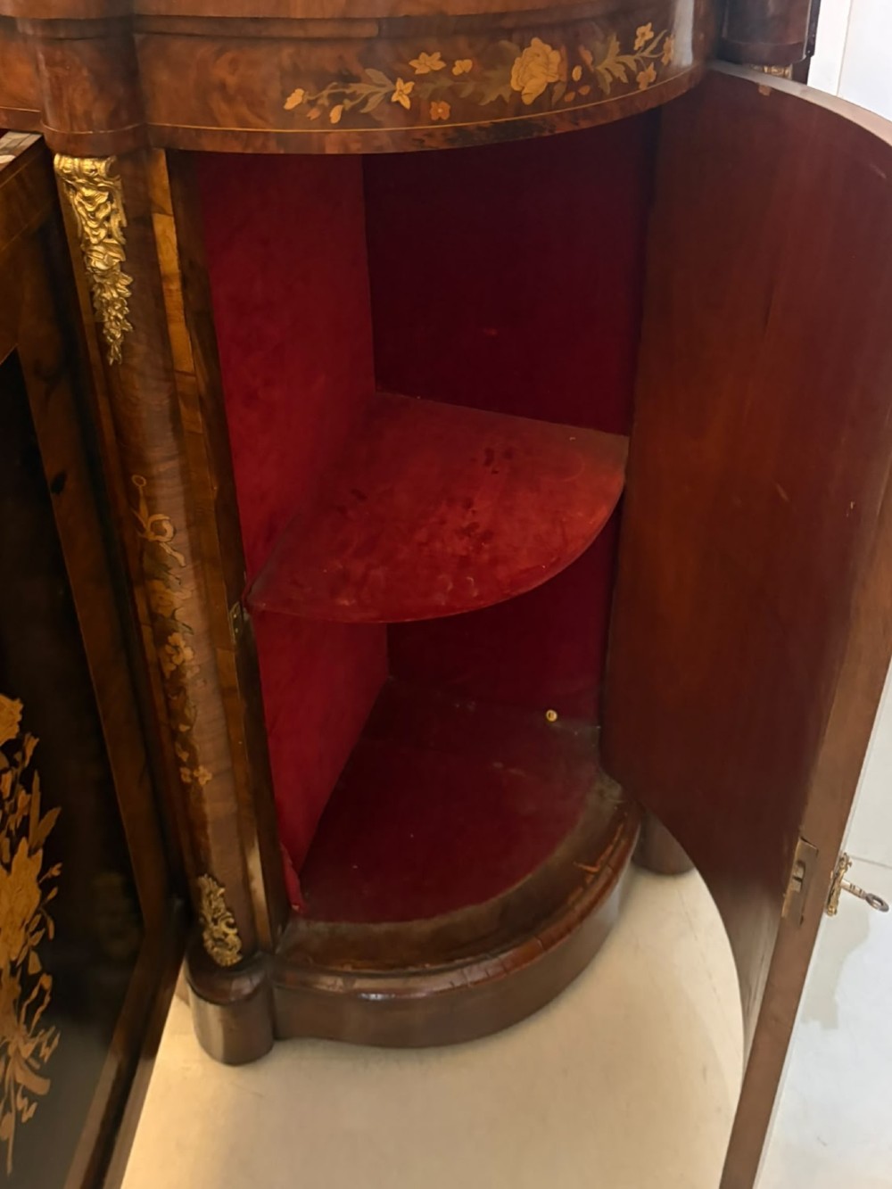 A nineteenth-century Victorian burr walnut credenza featuring curved side doors, intricate floral marquetry inlays, and gilt bronze mounts. View XIV