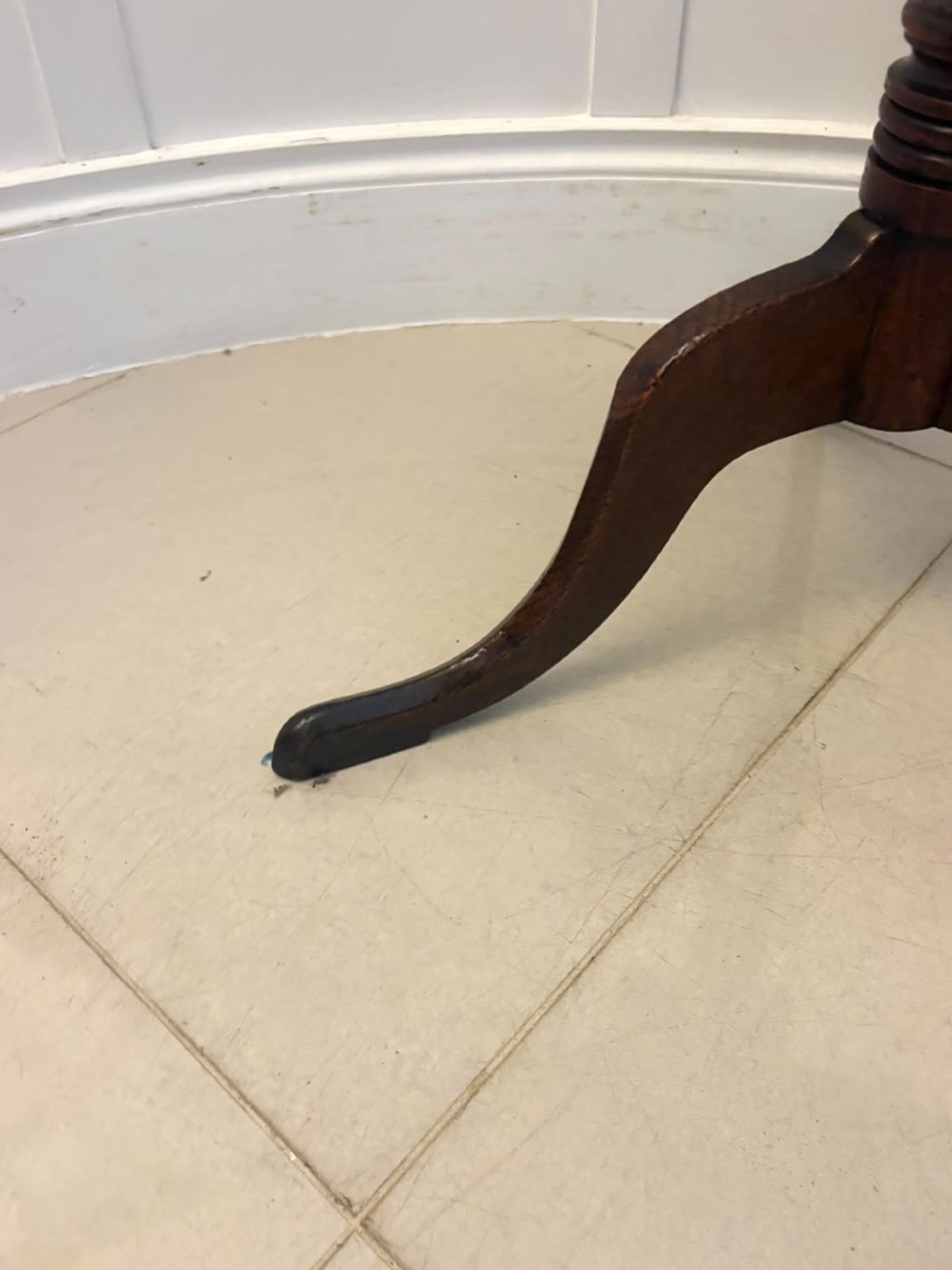 An 18th-century Georgian burr oak tilt-top occasional table featuring a circular surface, turned pedestal column, and tripod base shown upright. View X