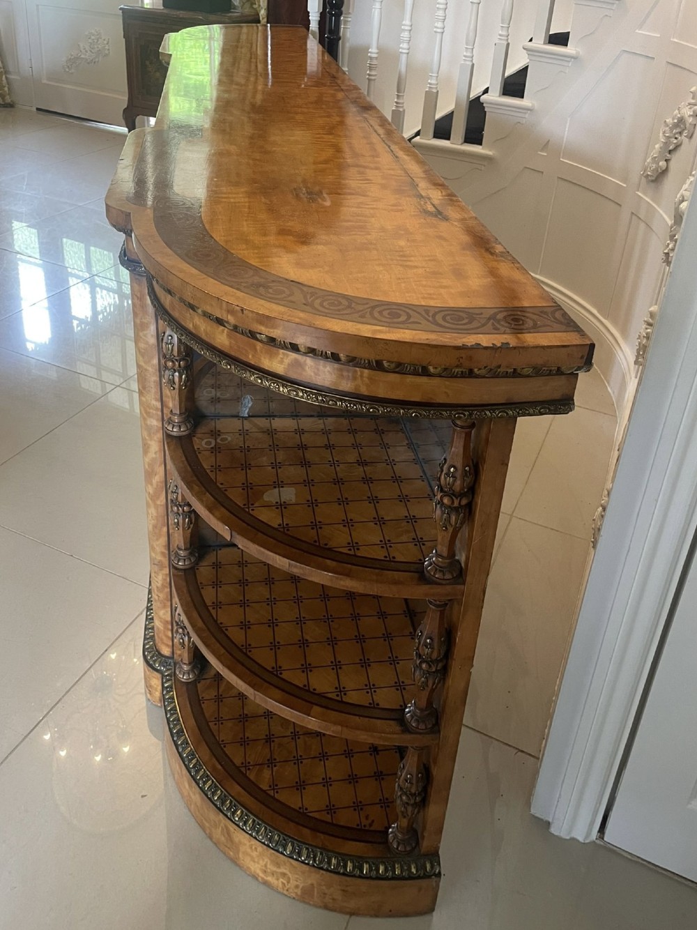 A large Victorian satinwood credenza featuring central glazed doors, oval porcelain plaques, and open curved side shelves. View XI