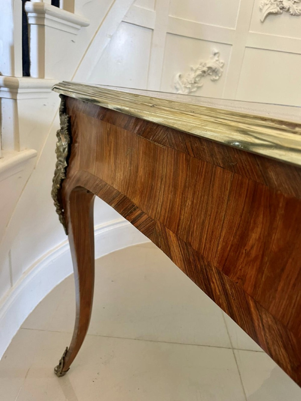 A French Louis XV style kingwood bureau plat featuring cabriole legs with ormolu mounts, three frieze drawers, and a leather inset writing surface. View VIII