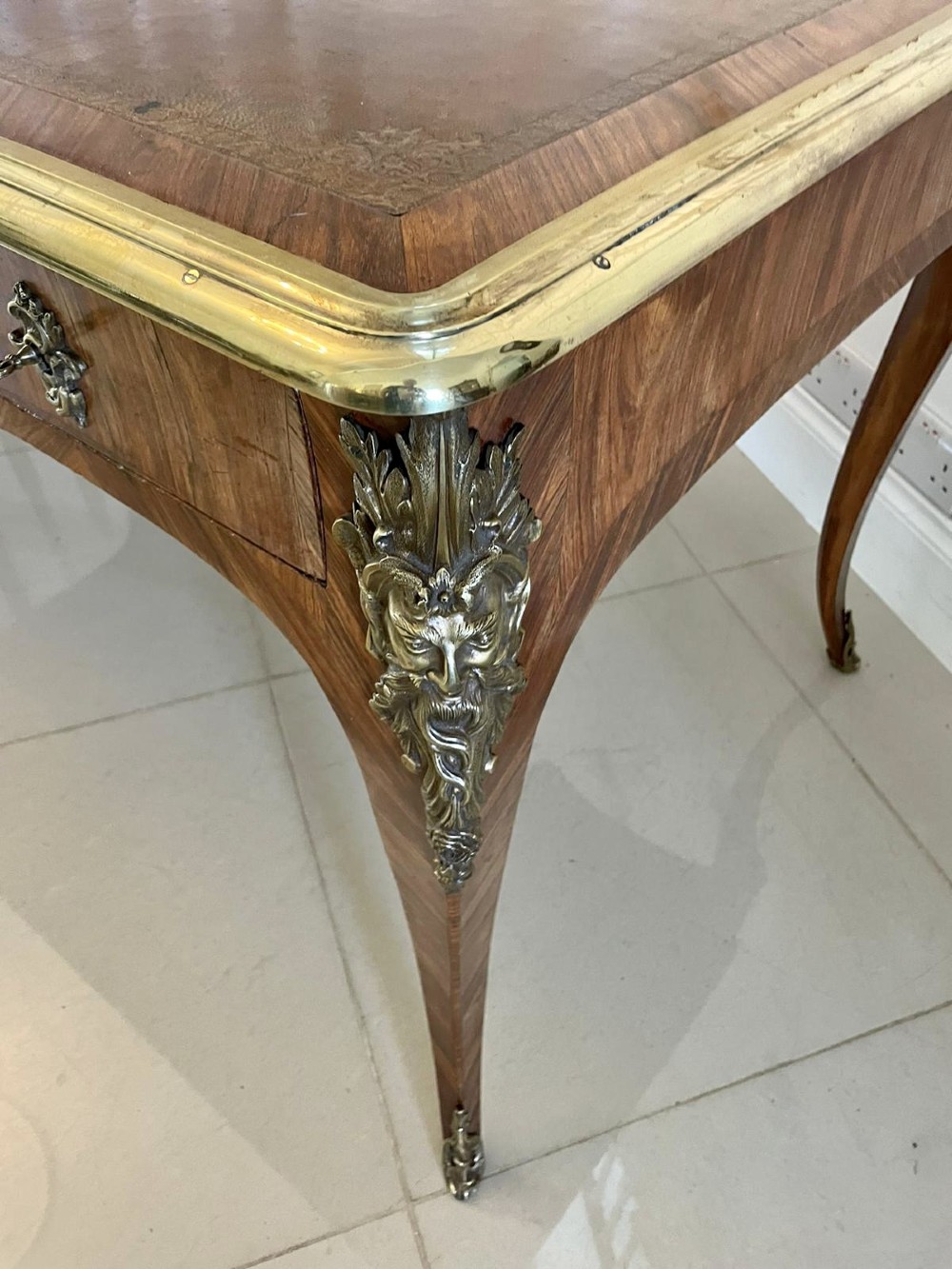 A French Louis XV style kingwood bureau plat featuring cabriole legs with ormolu mounts, three frieze drawers, and a leather inset writing surface. View XI