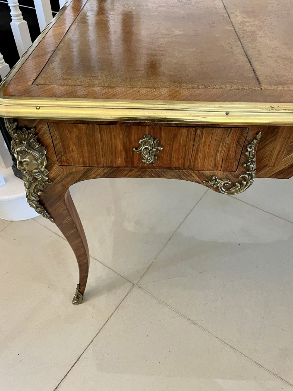 A French Louis XV style kingwood bureau plat featuring cabriole legs with ormolu mounts, three frieze drawers, and a leather inset writing surface. View XII