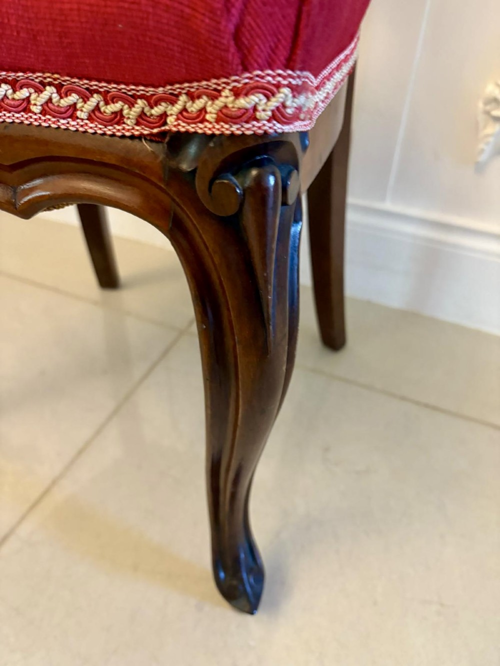 A set of Victorian carved mahogany dining chairs featuring open balloon-style backs and red velvet upholstered seats. View III
