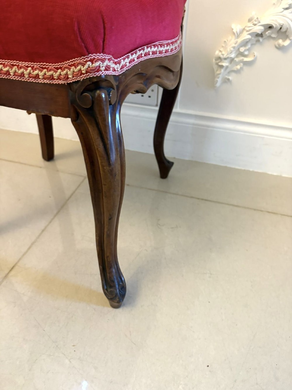 A set of Victorian carved mahogany dining chairs featuring open balloon-style backs and red velvet upholstered seats. View VII