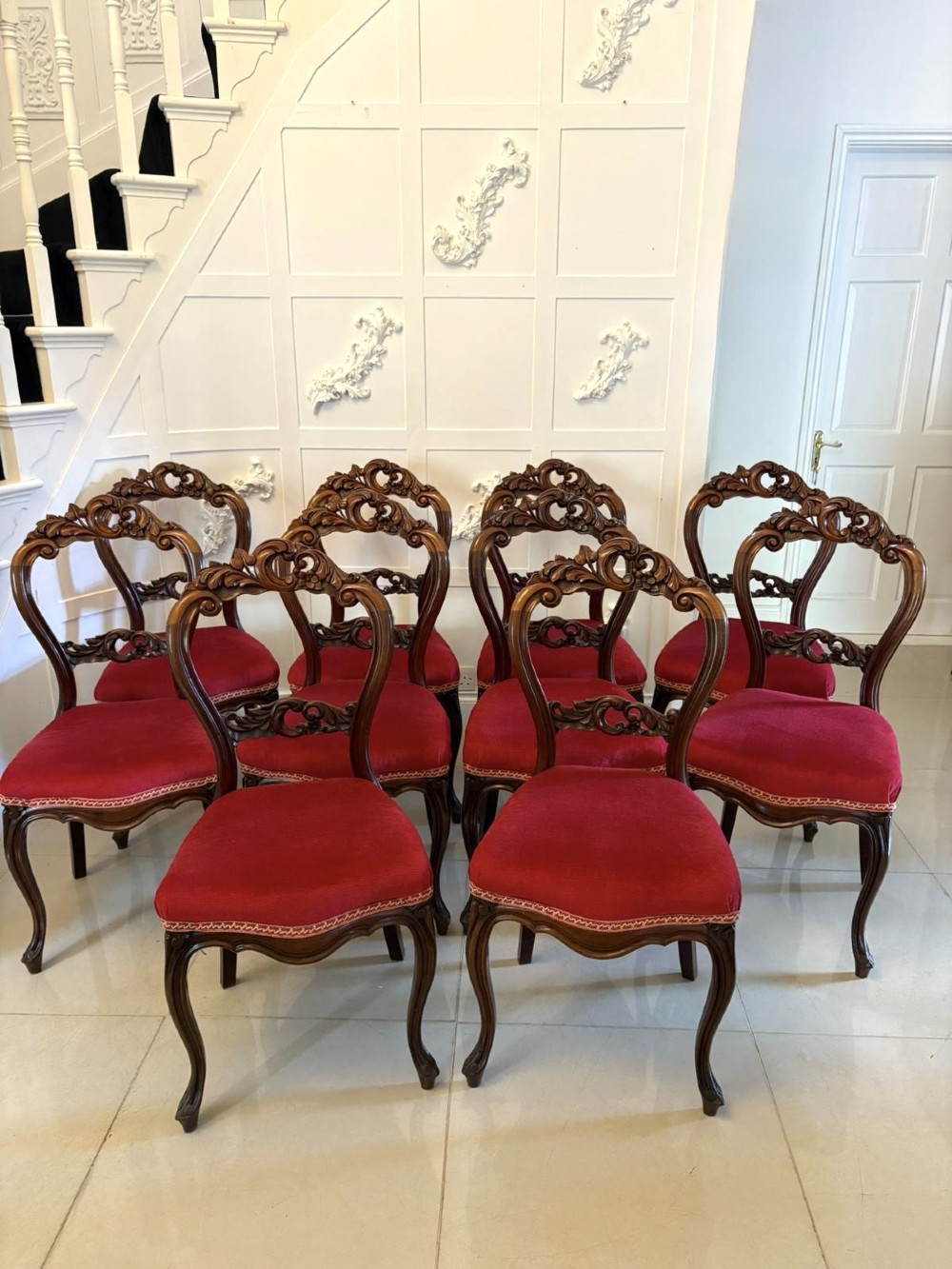 A set of Victorian carved mahogany dining chairs featuring open balloon-style backs and red velvet upholstered seats. View XI