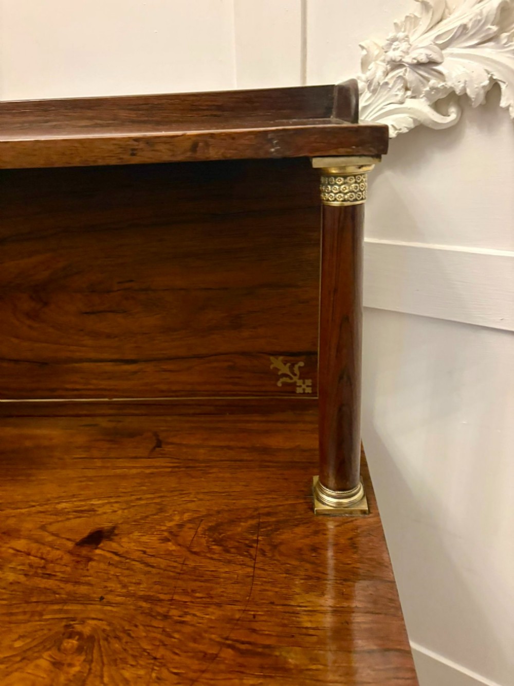 An antique Regency mahogany chiffonier side cabinet featuring intricate floral brass inlay on the doors and frieze with an upper open shelf. View XI