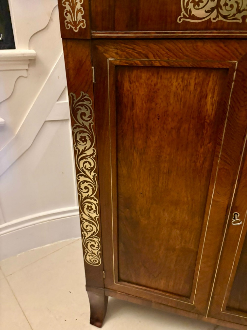 An antique Regency mahogany chiffonier side cabinet featuring intricate floral brass inlay on the doors and frieze with an upper open shelf. View XIII
