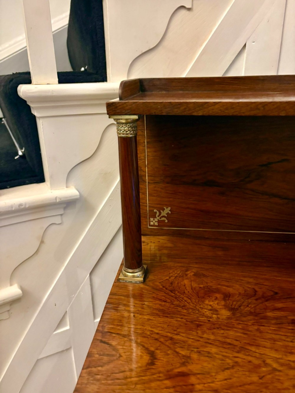 An antique Regency mahogany chiffonier side cabinet featuring intricate floral brass inlay on the doors and frieze with an upper open shelf. View XIV