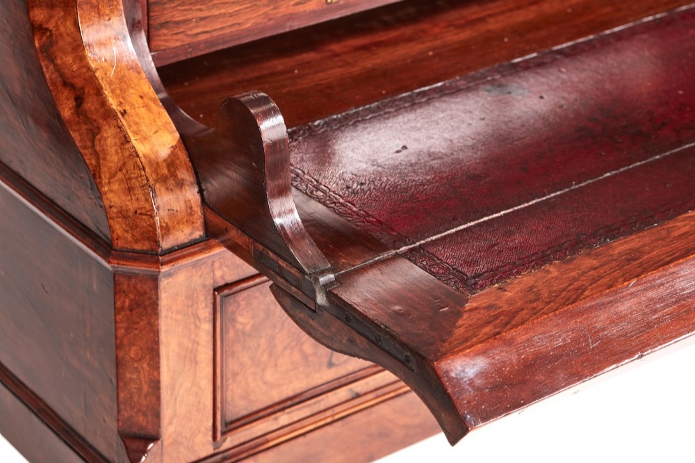 A Victorian burr walnut bureau writing desk featuring a fall-front flap, internal drawers, brass handles, and carved cabriole legs ending in paw feet. View III