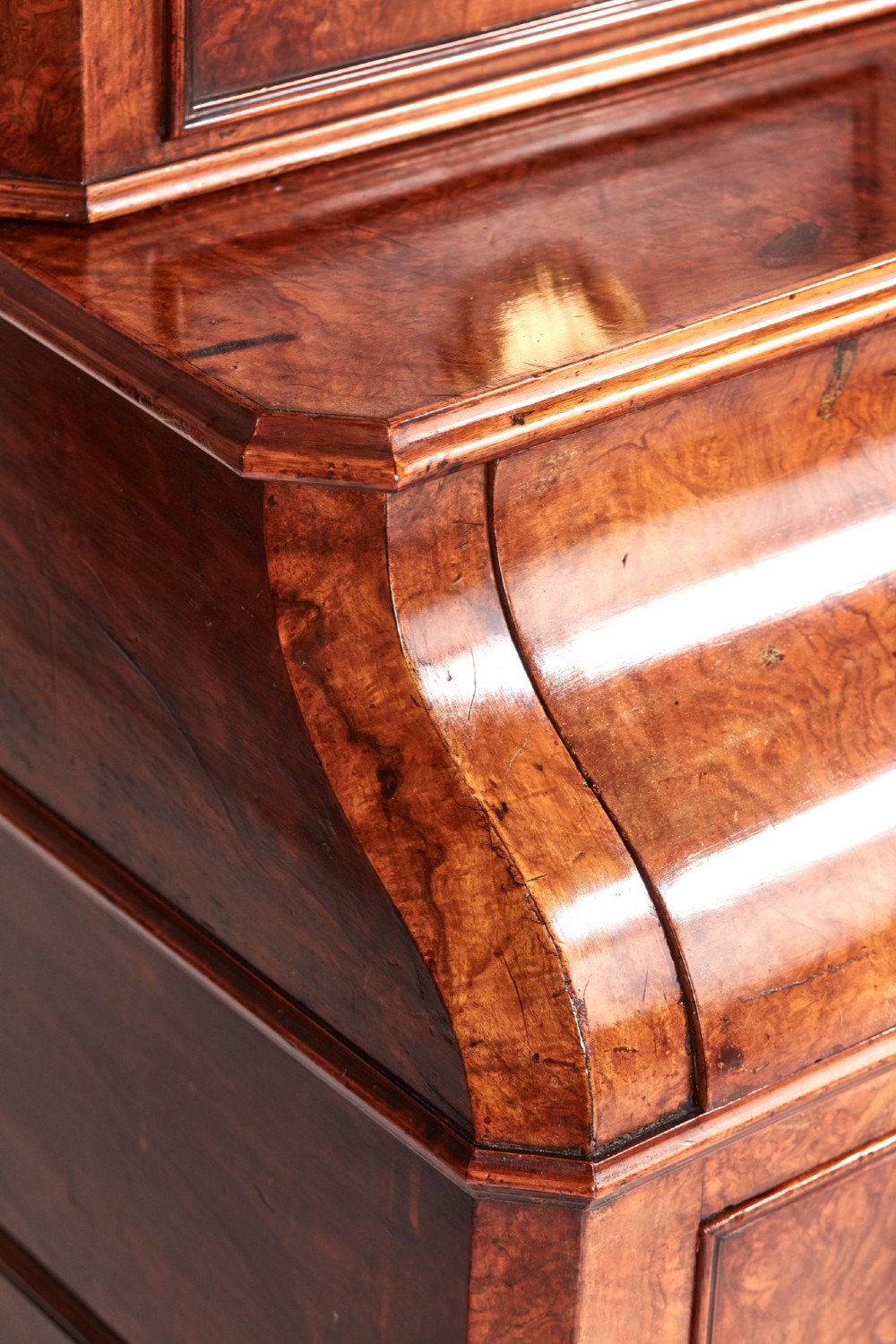 A Victorian burr walnut bureau writing desk featuring a fall-front flap, internal drawers, brass handles, and carved cabriole legs ending in paw feet. View V