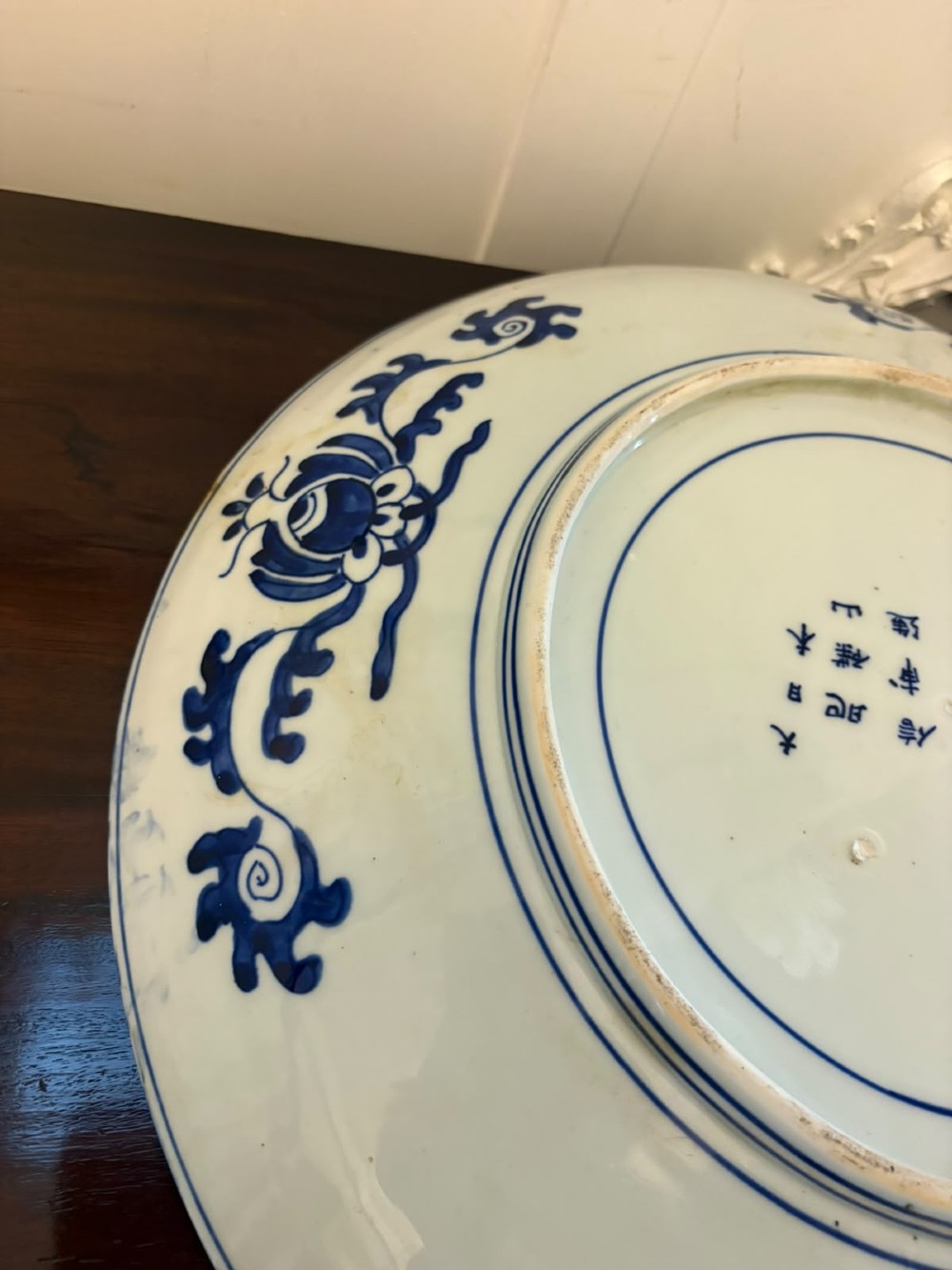 A pair of large circular blue and white Chinese porcelain chargers decorated with hand-painted birds and flowering branches. View VII
