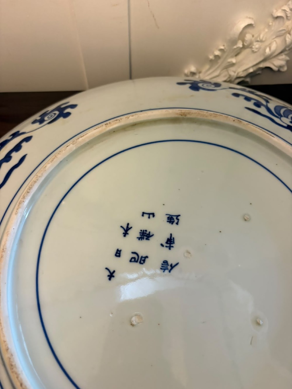 A pair of large circular blue and white Chinese porcelain chargers decorated with hand-painted birds and flowering branches. View VIII