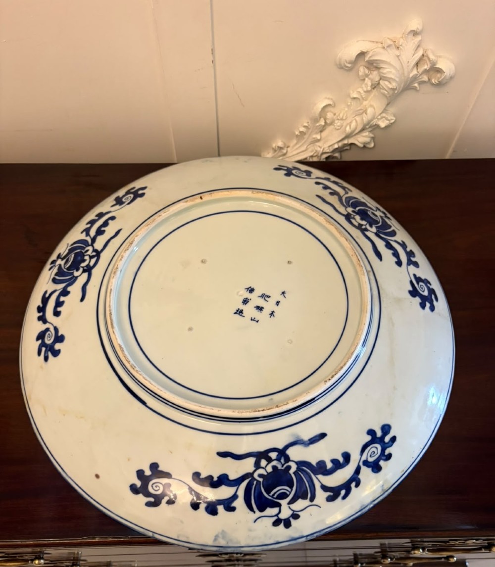 A pair of large circular blue and white Chinese porcelain chargers decorated with hand-painted birds and flowering branches. View XII