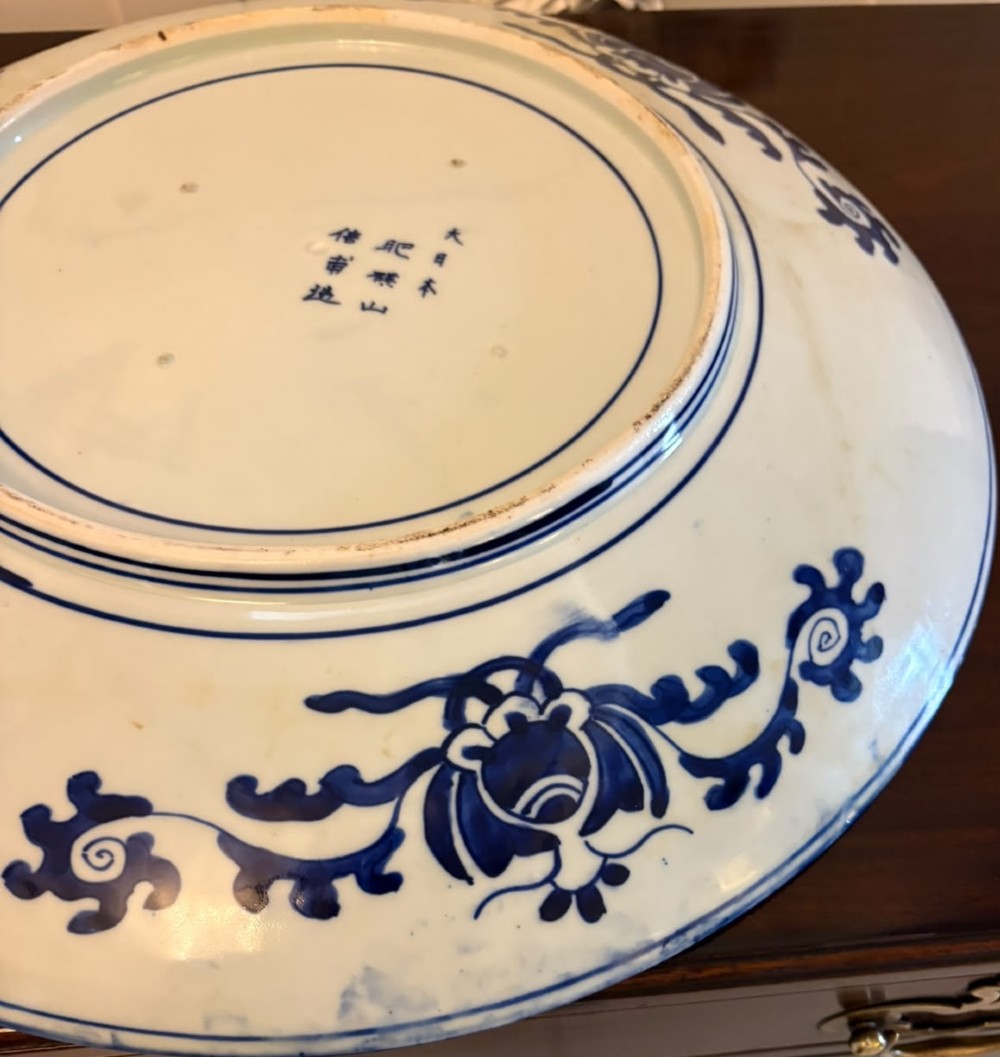 A pair of large circular blue and white Chinese porcelain chargers decorated with hand-painted birds and flowering branches. View XIII