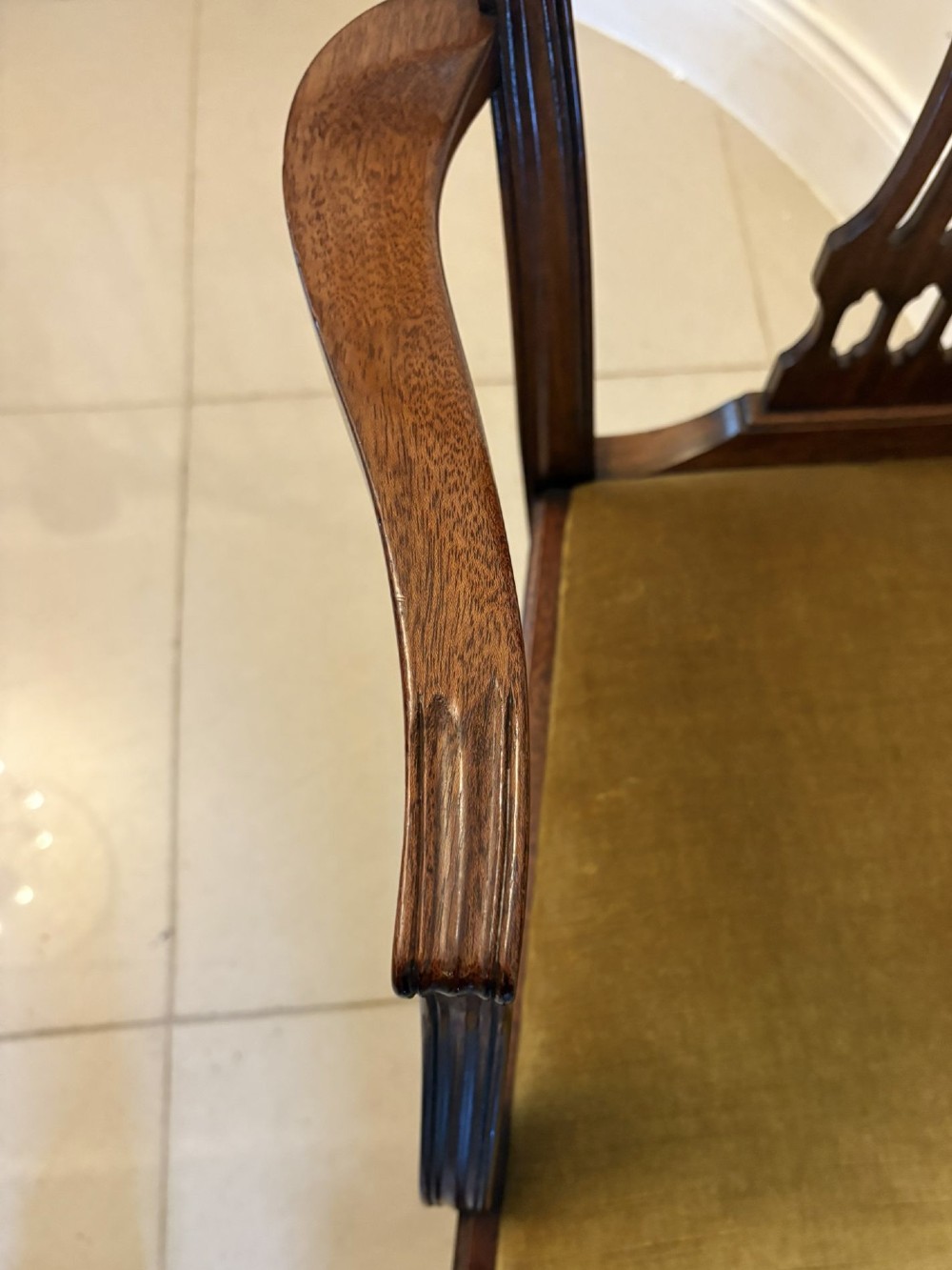 A set of twelve mahogany Hepplewhite style dining chairs featuring shield backs with carved splats and gold velvet drop-in seats. View VI