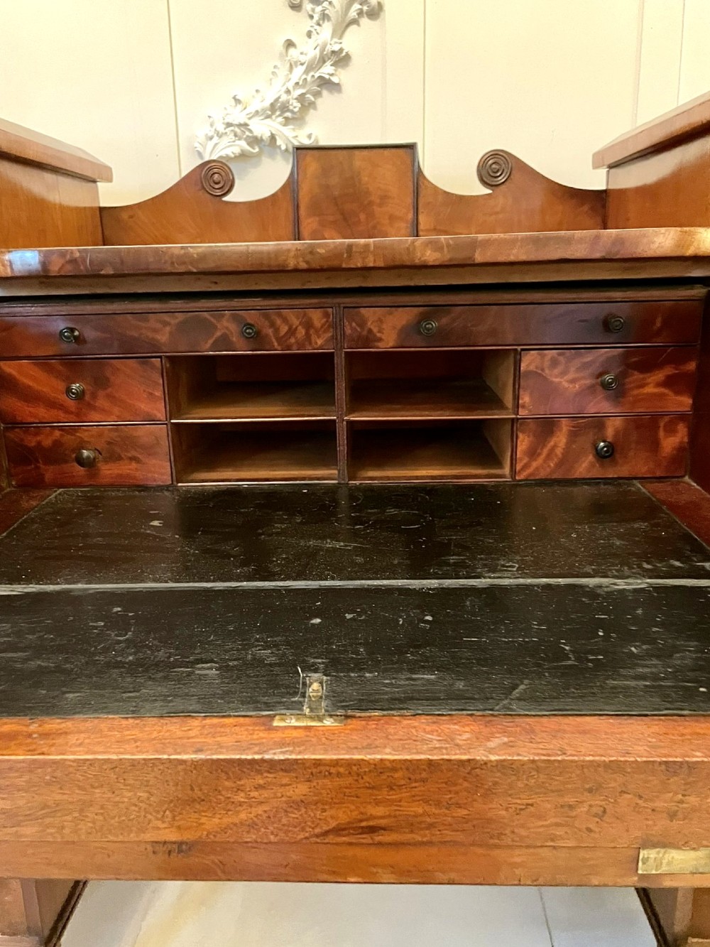 An antique Regency mahogany secretaire sideboard featuring twin pedestals, multiple drawers with brass ring pulls, and a scrolled backboard gallery. View III
