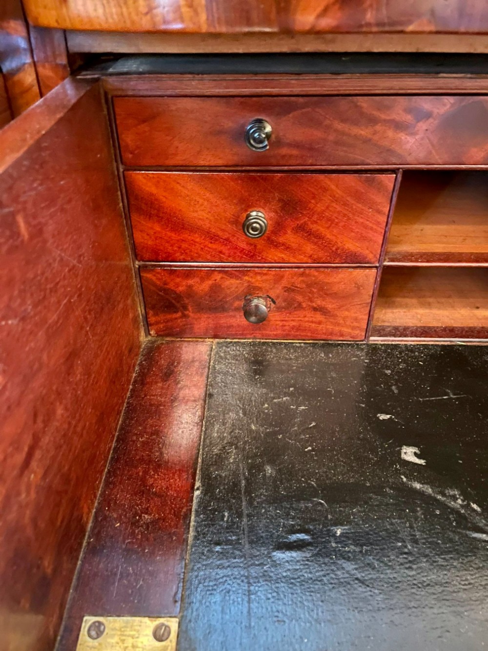 An antique Regency mahogany secretaire sideboard featuring twin pedestals, multiple drawers with brass ring pulls, and a scrolled backboard gallery. View XIII