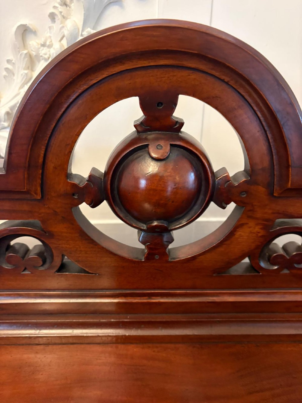 A Victorian mahogany buffet server featuring an openwork carved gallery back, four drawer compartments, turned columns, and an open lower shelf. View II