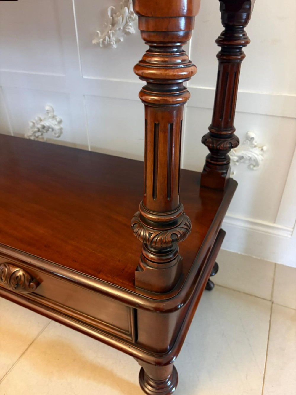 A Victorian mahogany buffet server featuring an openwork carved gallery back, four drawer compartments, turned columns, and an open lower shelf. View VII