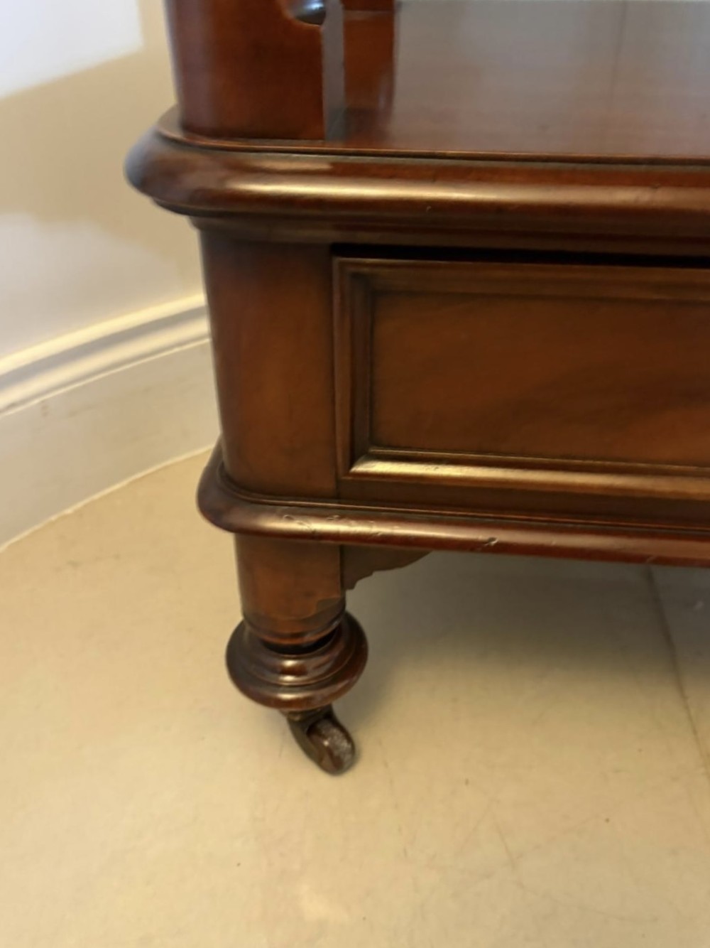 A Victorian mahogany buffet server featuring an openwork carved gallery back, four drawer compartments, turned columns, and an open lower shelf. View VIII