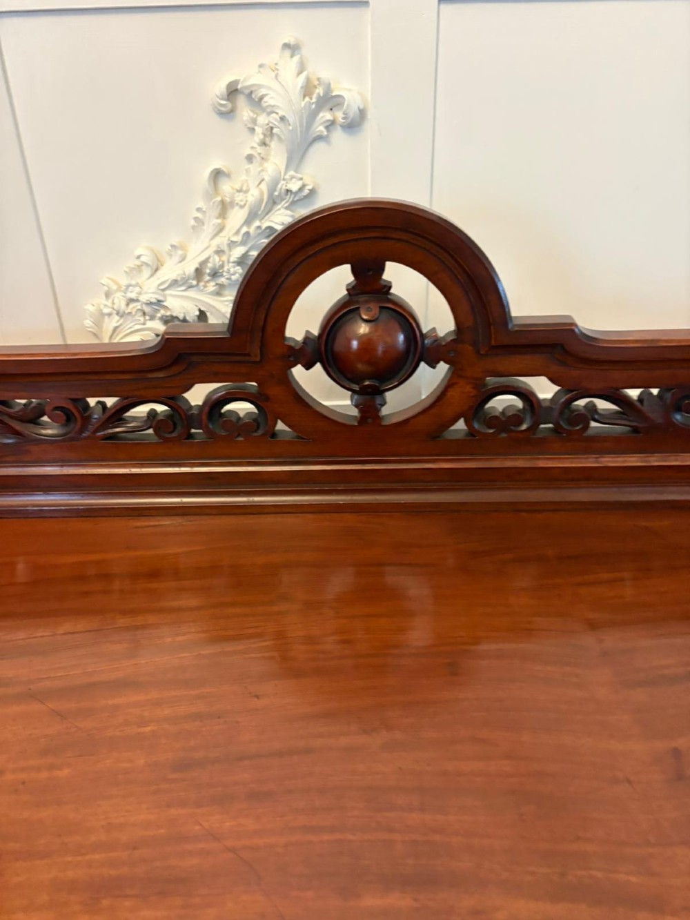 A Victorian mahogany buffet server featuring an openwork carved gallery back, four drawer compartments, turned columns, and an open lower shelf. View XIII