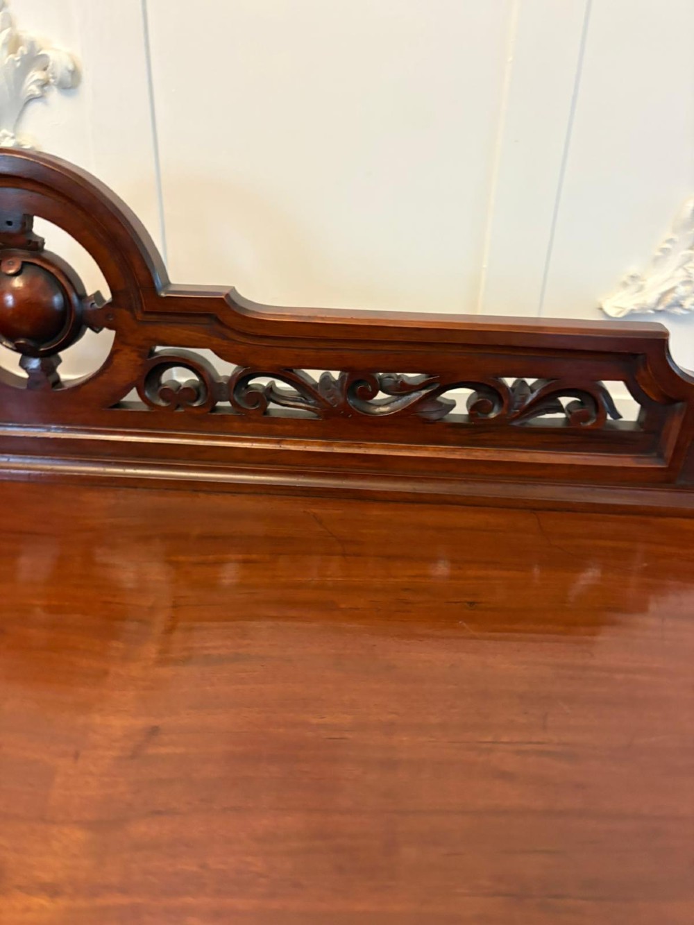 A Victorian mahogany buffet server featuring an openwork carved gallery back, four drawer compartments, turned columns, and an open lower shelf. View XIV