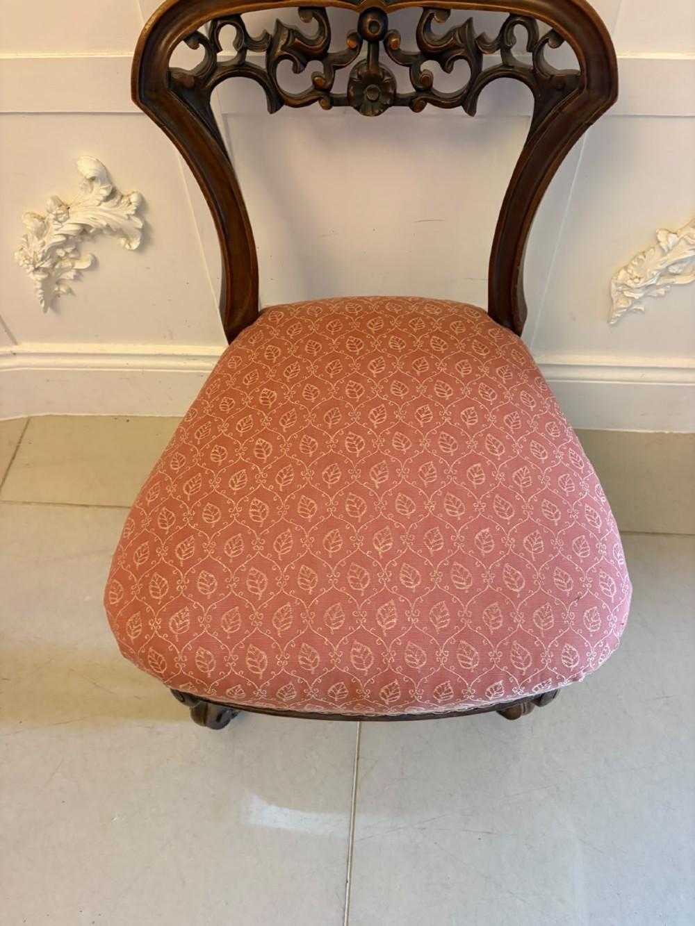 A set of four antique Victorian side chairs featuring ebonised black frames with turned spindle backrests, gilt details, turned front legs, and terracotta patterned upholstered seats. View II
