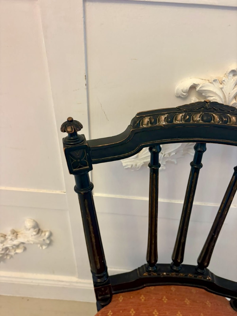 A set of four antique Victorian side chairs featuring ebonised black frames with turned spindle backrests, gilt details, turned front legs, and terracotta patterned upholstered seats. View XII