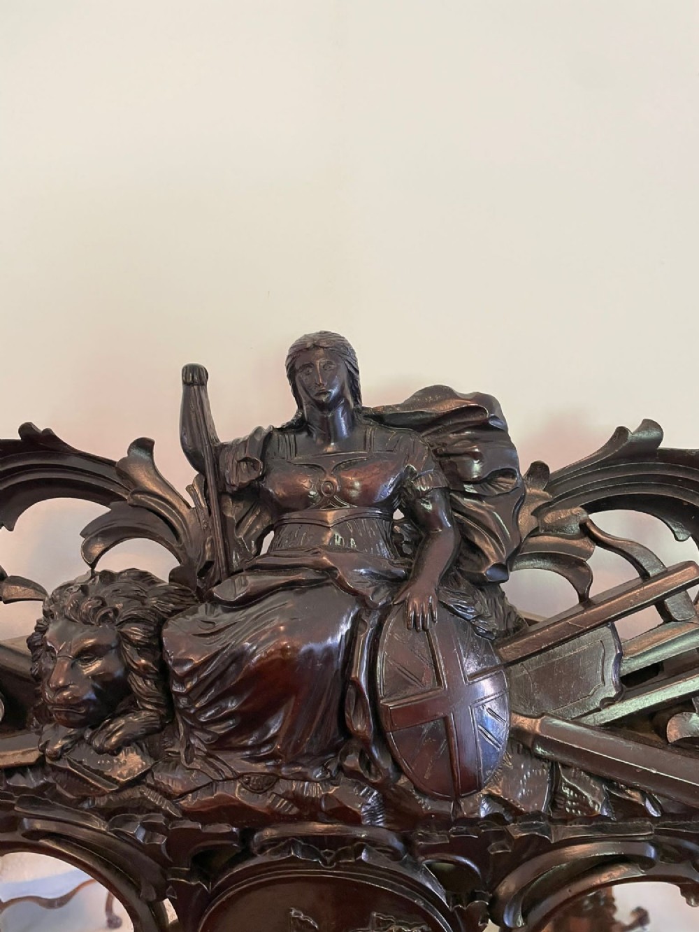 An exceptionally large Victorian dark mahogany console table featuring carved caryatid figures, elaborate scrollwork, a large arched mirror back, and a contoured plinth base. View XIV