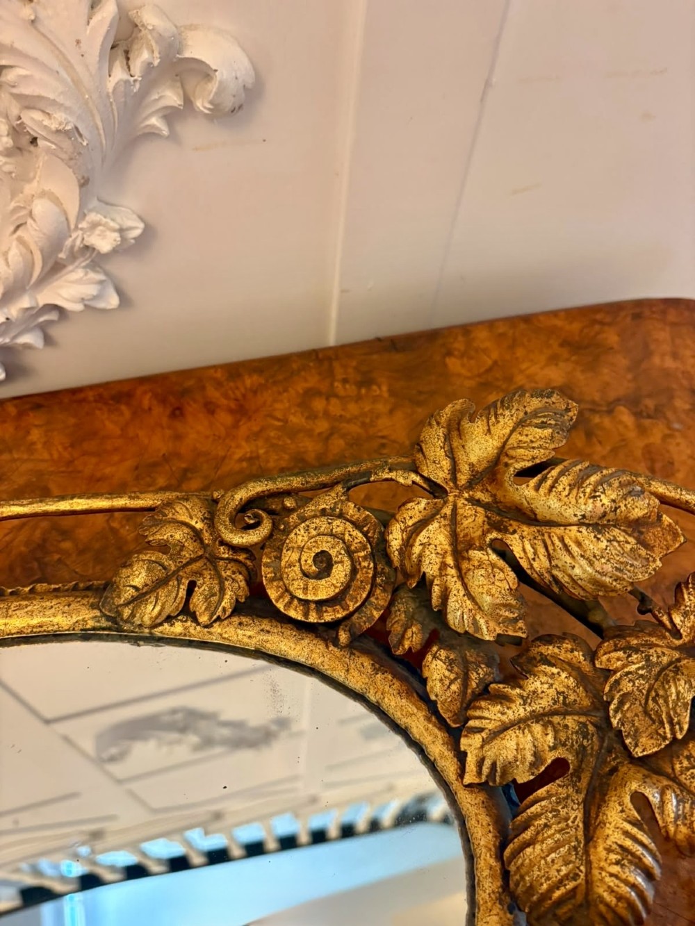 An oval gilt metal tray featuring a central mirror panel surrounded by an ornate border of sculpted grapevines, leaves, and grape clusters. View IV