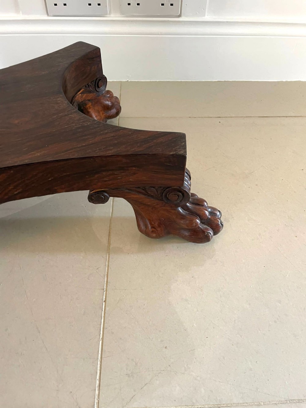 A William IV dark rosewood fold-over card table featuring a gadrooned top edge, scroll carvings, a central pedestal column, and a plinth base on carved claw feet. View VI