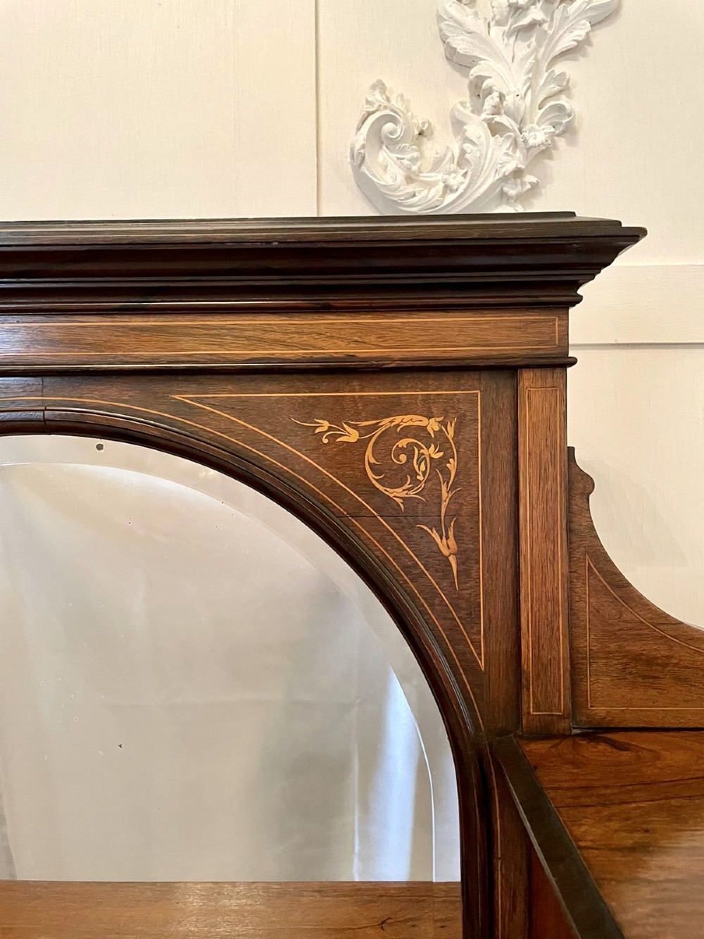 An antique Victorian dark rosewood writing desk featuring decorative floral marquetry inlays, turned legs, and an upper superstructure with twin glazed cabinets and an arched mirror. View VI