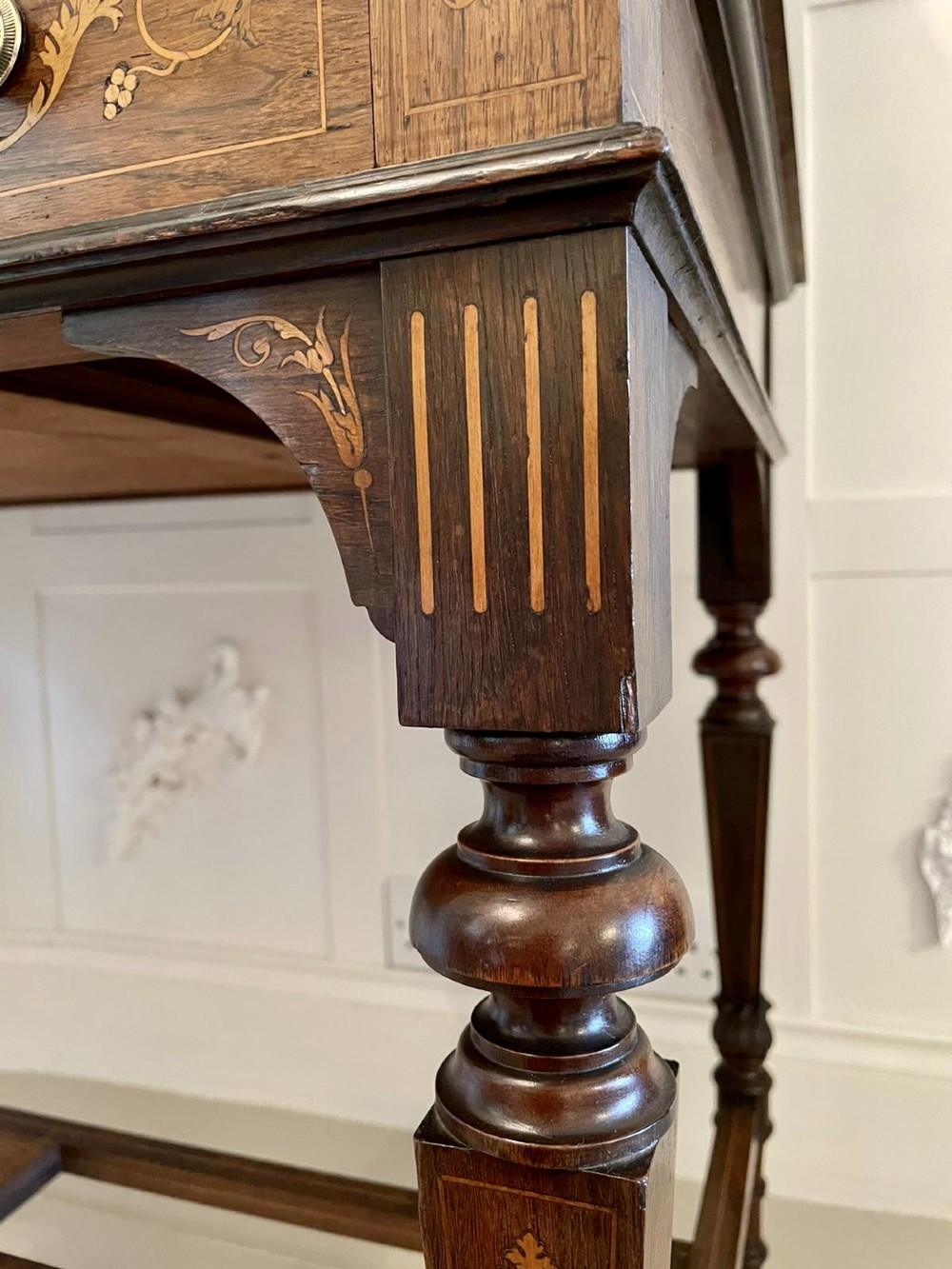 An antique Victorian dark rosewood writing desk featuring decorative floral marquetry inlays, turned legs, and an upper superstructure with twin glazed cabinets and an arched mirror. View VII