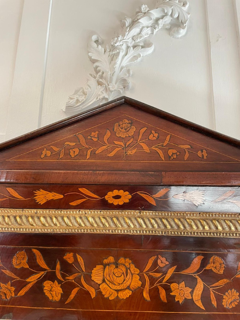 A tall mahogany wall mirror featuring a pediment top and detailed floral marquetry inlay across the entire timber frame. View II