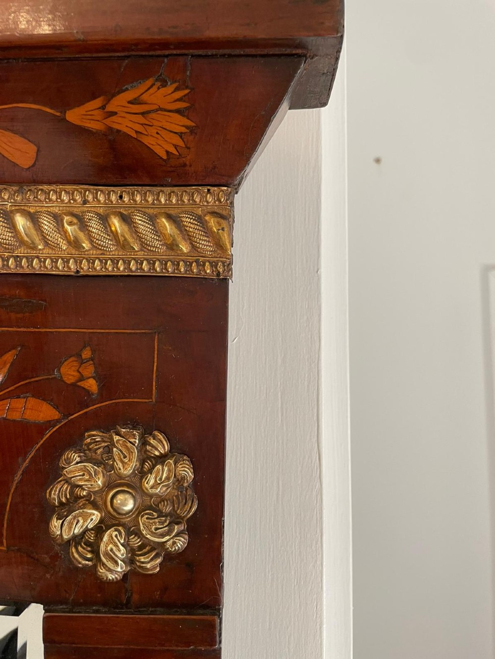 A tall mahogany wall mirror featuring a pediment top and detailed floral marquetry inlay across the entire timber frame. View V