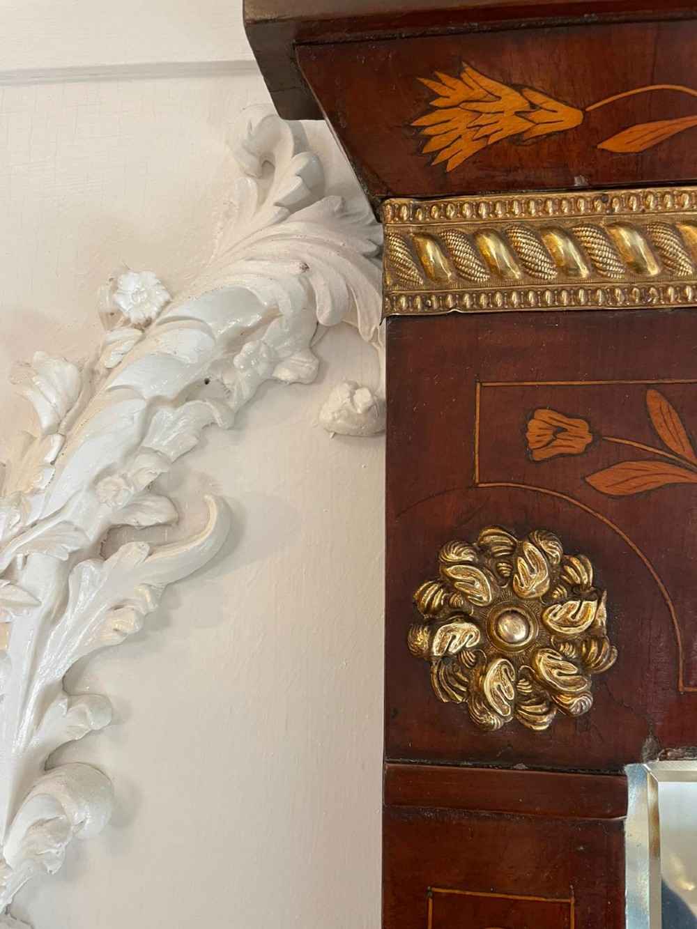 A tall mahogany wall mirror featuring a pediment top and detailed floral marquetry inlay across the entire timber frame. View VI